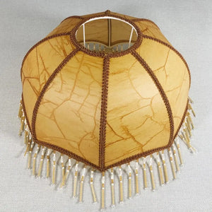 Abat-jour rétro modèle Doré, tissu ambré doré franges perles cuivrées