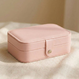 Boîte à bijoux de voyage en simili cuir coloris rose