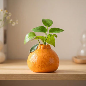 Vase en forme d'orange en céramique coloris orange vif