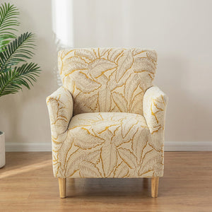 Housse de fauteuil jaune à motif de feuilles en jacquard sur un fauteuil club