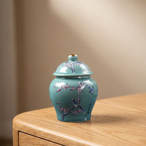 Vase chinois en céramique turquoise avec fleurs de prunier roses et oiseaux