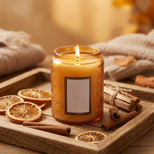 Bougie parfumée Ambre Baltique en pot de verre ambré avec orange séché et cannelle