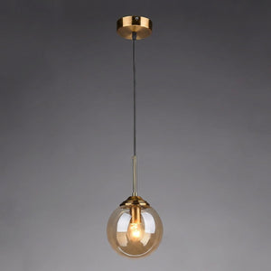 Suspension globe en verre ambre avec monture laiton dore