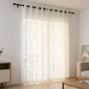 Rideau voilage jacquard blanc à œillets suspendu à une tringle