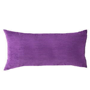 Photo du traversin violet en velours côtelé rayé sur fond studio