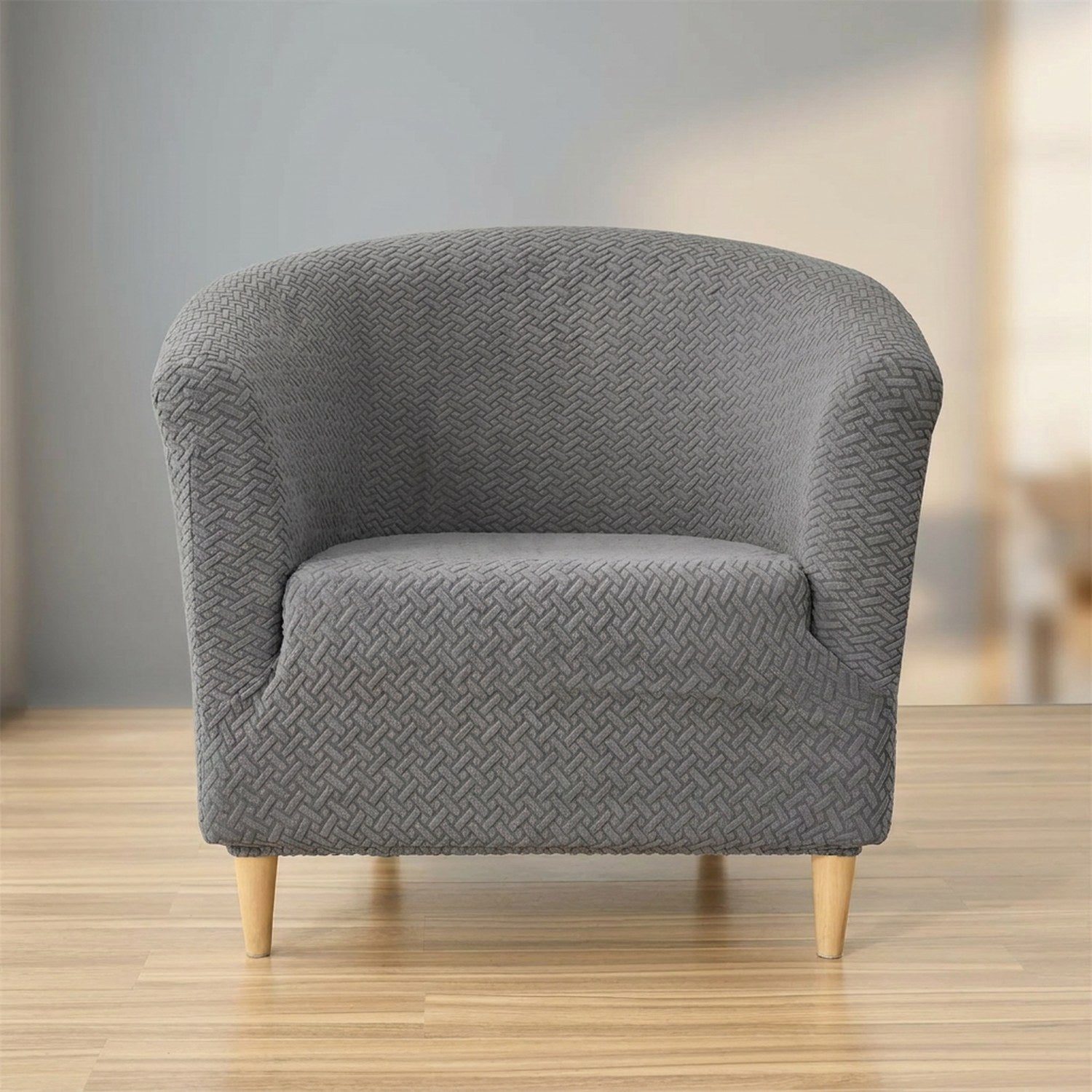Housse de fauteuil club en jacquard texturé gris sur un fauteuil cabriolet