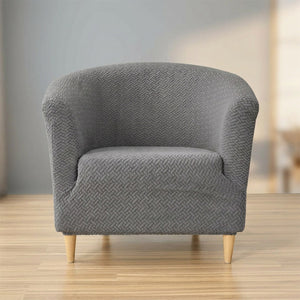 Housse de fauteuil club en jacquard texturé gris sur un fauteuil cabriolet