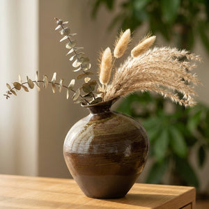 Vase céramique imitation pierre vert avec branches séchées