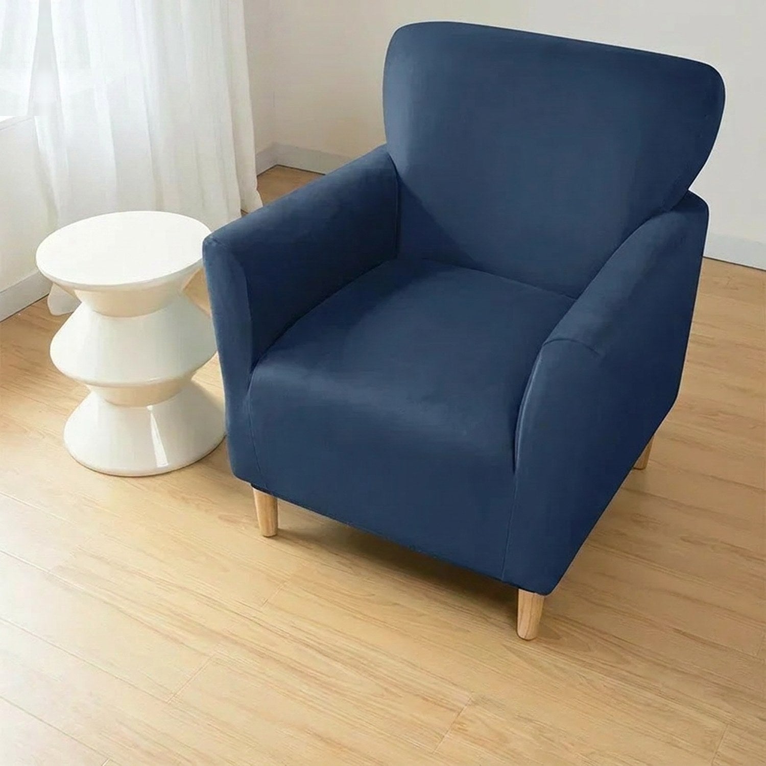 Housse de fauteuil club couleur Bleu foncé installée sur un fauteuil