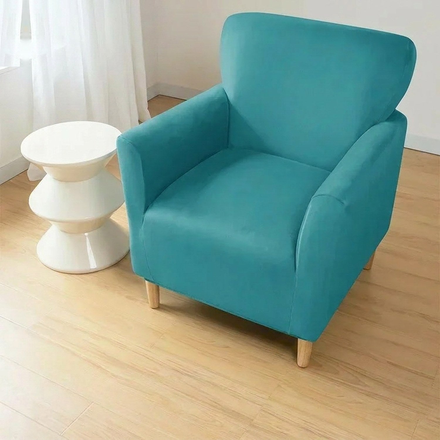 Housse de fauteuil club couleur Turquoise installée sur un fauteuil