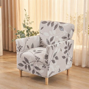 Fauteuil club housse motif feuillage gris sur fond clair