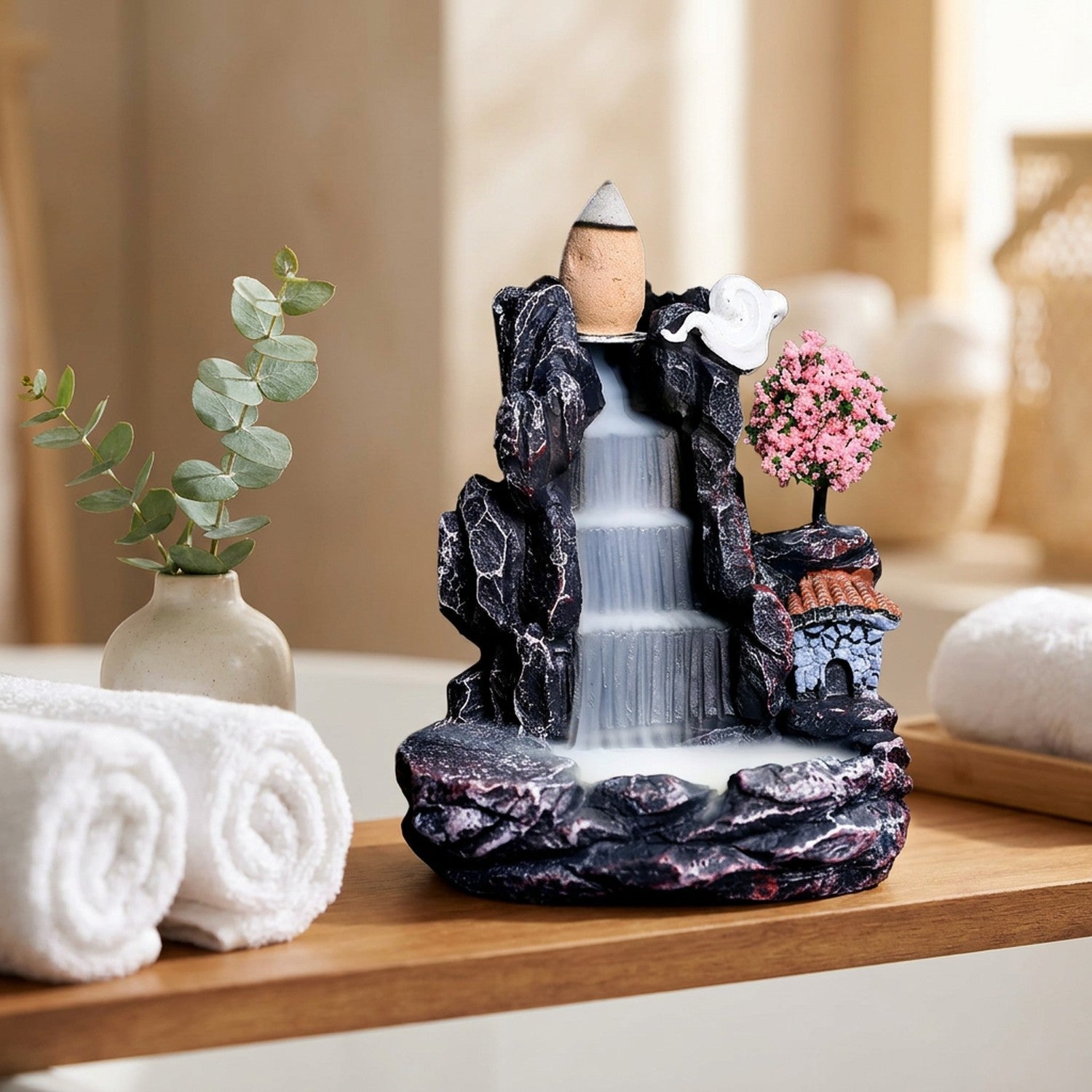 Brûleur d'encens à reflux sur une étagère de salle de bain zen avec serviettes