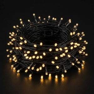 Guirlande lumineuse LED blanc chaud doré fond sombre ambiance cosy