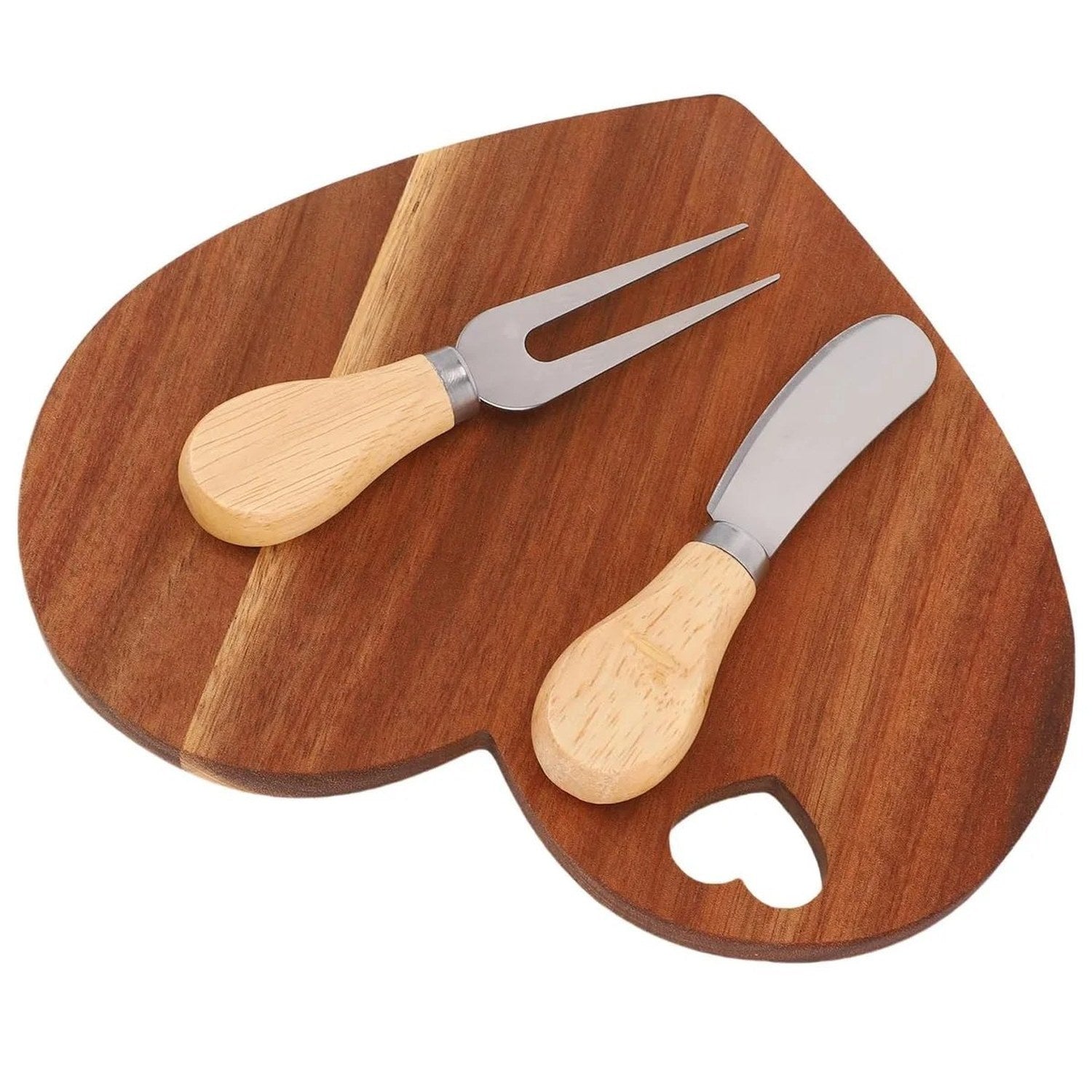 Vue du dessus de la planche apéritif cœur avec couteau beurre et fourchette à fromage