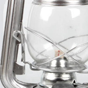 Détail du globe en verre soufflé et de l'anse en fer