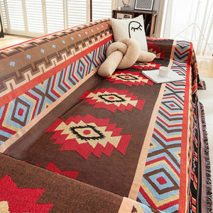 Détail des motifs aztèques tissés en rouge brun et bleu du couvre-lit
