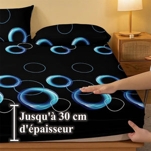 Main soulevant le coin élastiqué du drap-housse jusqu'à 30 cm d'épaisseur de matelas