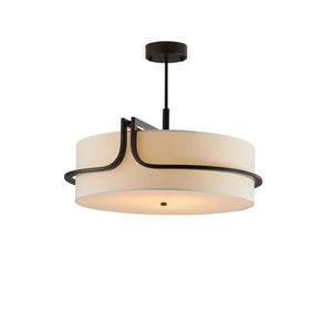 Lustre en tissu crème et métal noir vu de trois quarts sur fond neutre