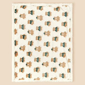 Couverture bébé motif ours au col vert vue à plat