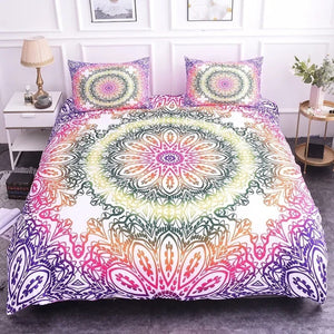 Parure de lit mandala dégradé rose posée sur un lit vue complète