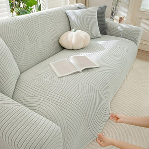Housse velours gris clair ajustée sur canapé