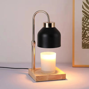 Lampe chauffe-bougie noire vue de face sur socle en bois