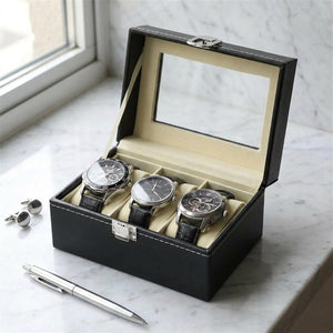 Boîte à montres ouverte sur un plan de travail en marbre