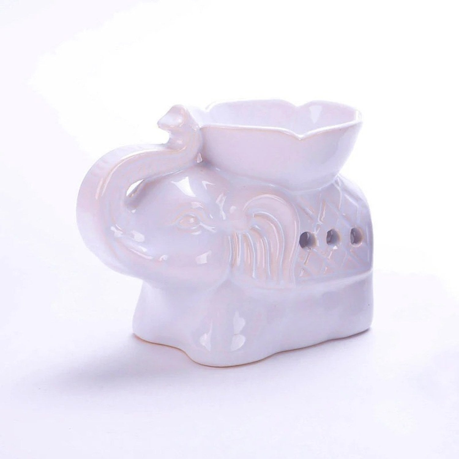 Brûle-parfum céramique éléphant blanc vu de face sur fond neutre