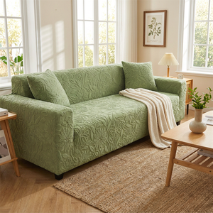 Housse de canapé jacquard camélia vert sauge en salon