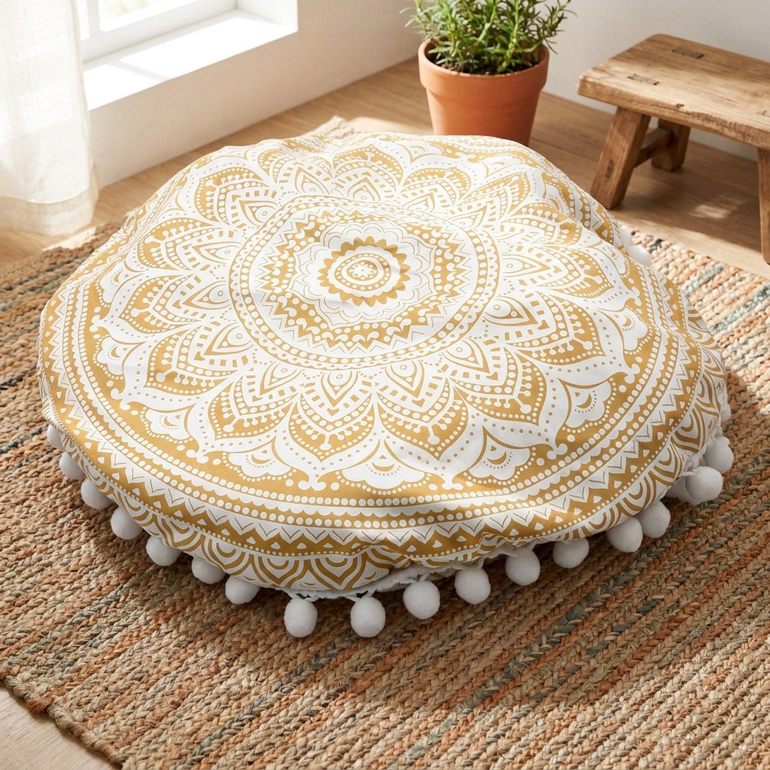 Coussin de sol rond motif mandala doré et blanc avec pompons