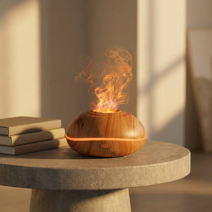 Diffuseur d'arôme flamme bois sur table béton en lumière dorée