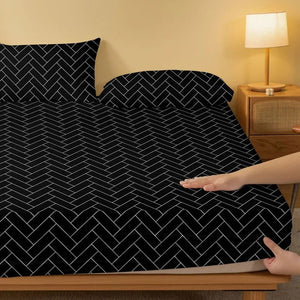 Drap housse chevrons noir et blanc dans une chambre avec lampe de chevet