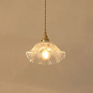 Suspension petite fleur en verre transparent allumée, cordon tressé et support laiton
