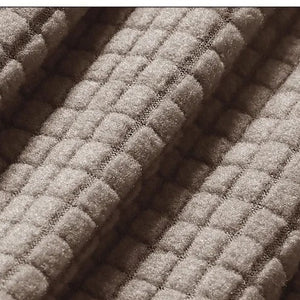 Gros plan sur le tissage jacquard doux et texturé de la housse de chaise