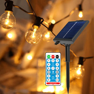Gros plan des ampoules G40 à filament avec le panneau solaire et la télécommande