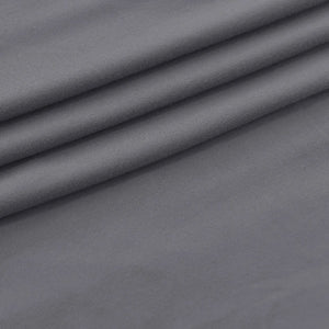 Gros plan sur le tissu extensible et hydrofuge de la housse de fauteuil