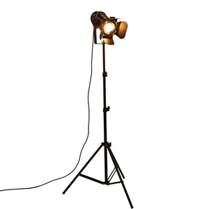 Lampadaire trépied projecteur noir fond blanc