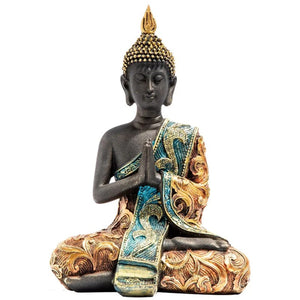 Vue de face de la statue bouddha thaï artisanale en résine noire avec ornements dorés et turquoise