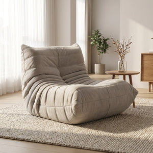 Pouf géant canapé de sol gris en velours posé au sol