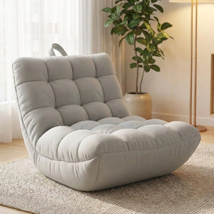 Pouf fauteuil paresseux gris clair dans un salon moderne près d une fenêtre