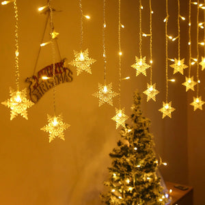 Rideau guirlande flocon de neige LED blanc chaud ambiance Noël avec sapin