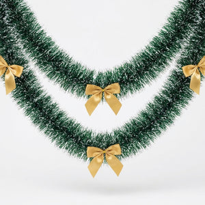 Guirlande de Noël verte avec nœuds dorés