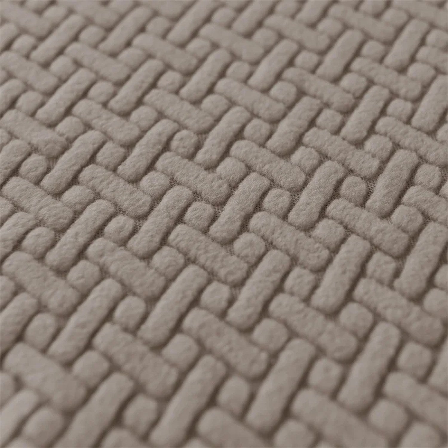 Détail du motif tressé du tissu jacquard de la housse d'accoudoir