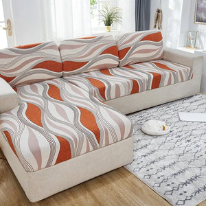 Housse d'assise crème et terracotta à vagues sur un canapé d'angle