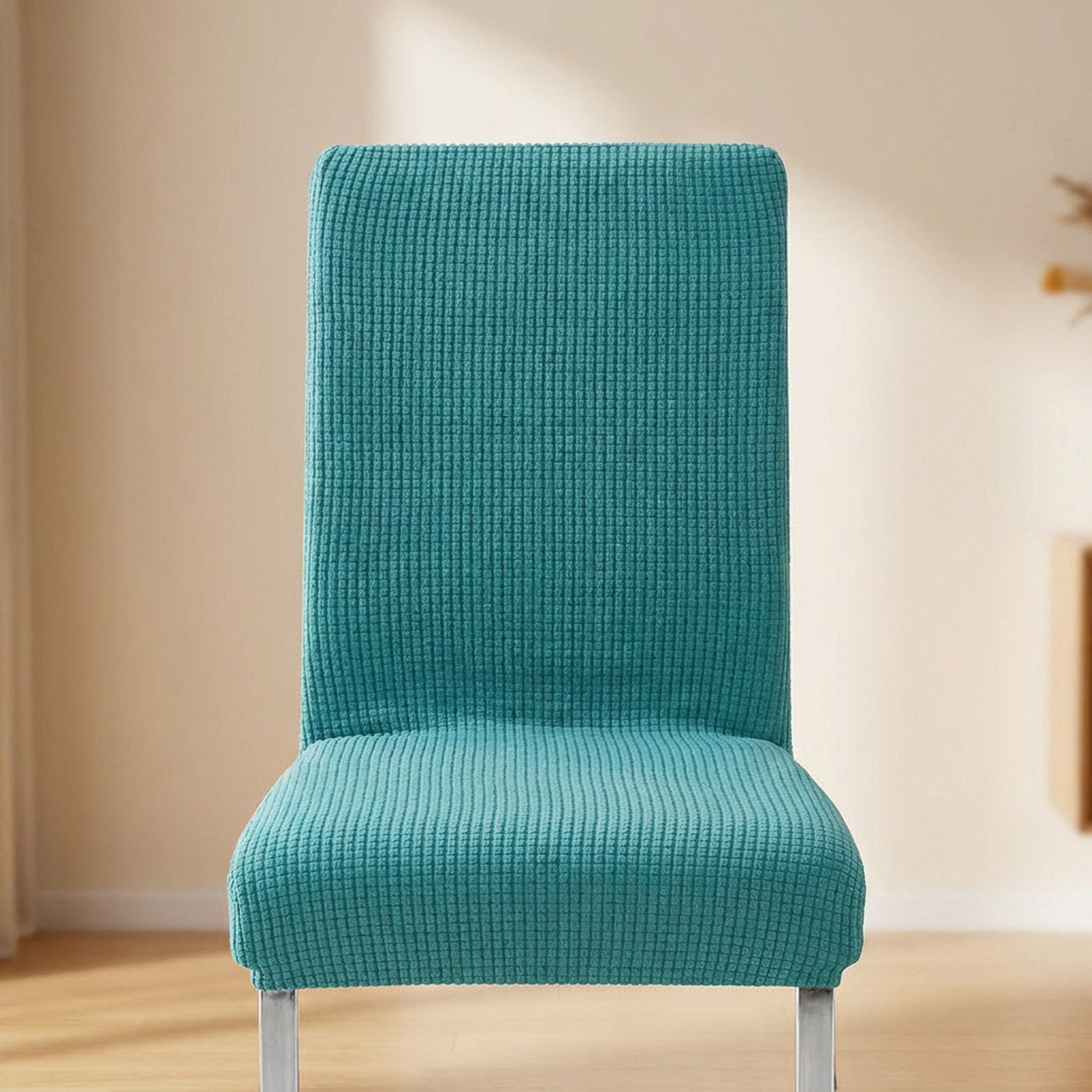 Housse de chaise extensible en maille jacquard Turquoise sur une chaise de salle à manger