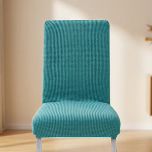 Housse de chaise extensible en maille jacquard Turquoise sur une chaise de salle à manger