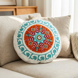 Housse de coussin ronde brodée mandala modèle Étoile Ambrée motif étoile orange et bordeaux