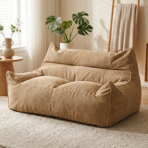 Housse de canapé poire deux places en coton gaufré kaki dans un salon cosy