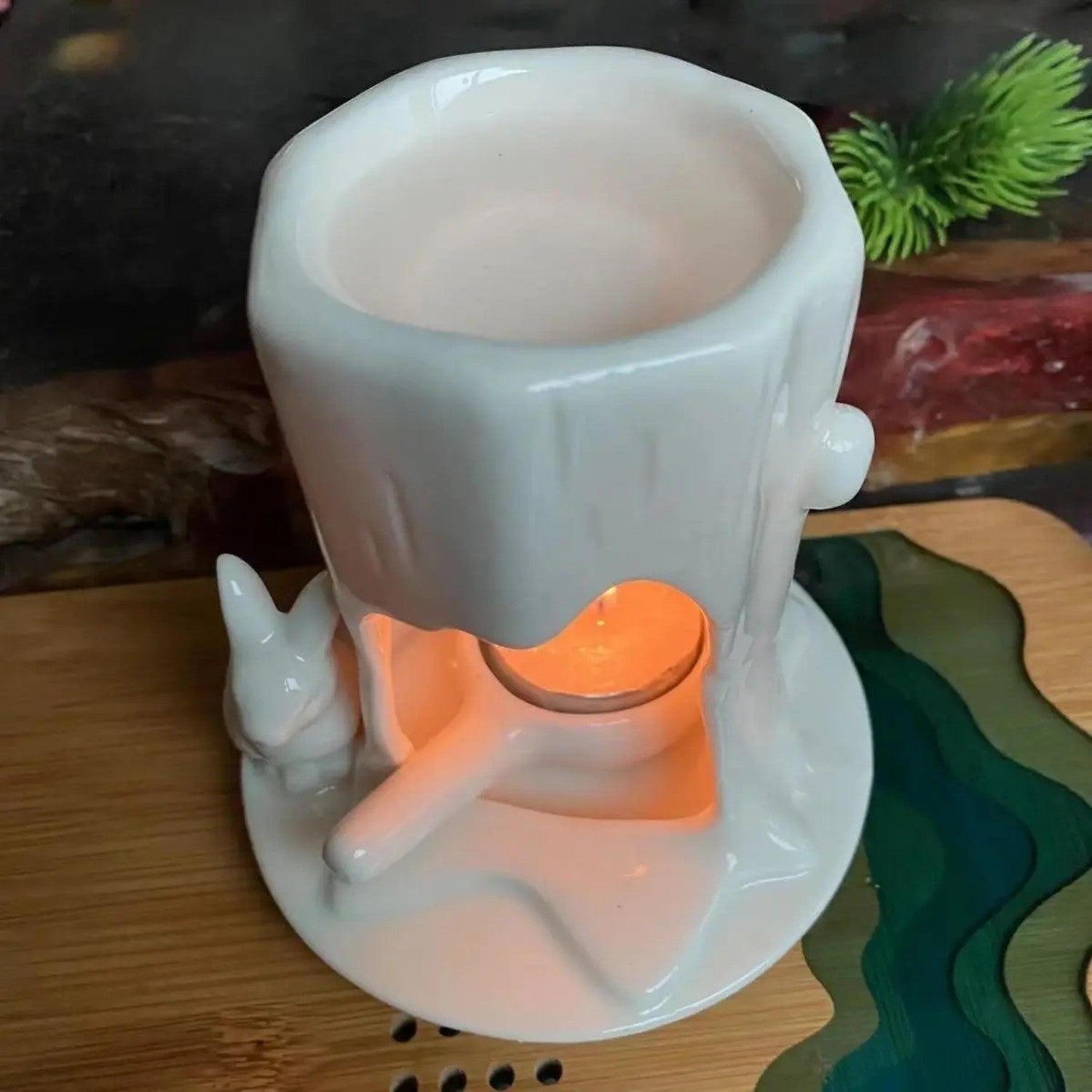 Vue de dessus du brûleur à huile céramique lapin montrant le réservoir supérieur et la flamme