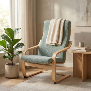 Housse de fauteuil scandinave vert sauge en jacquard ondulé près d une fenêtre